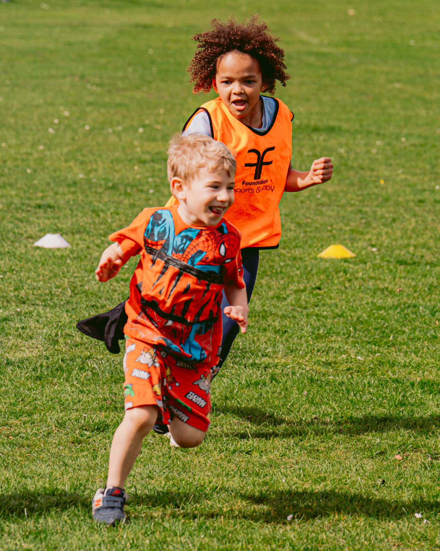 Children running together during a Foundation outdoor activity